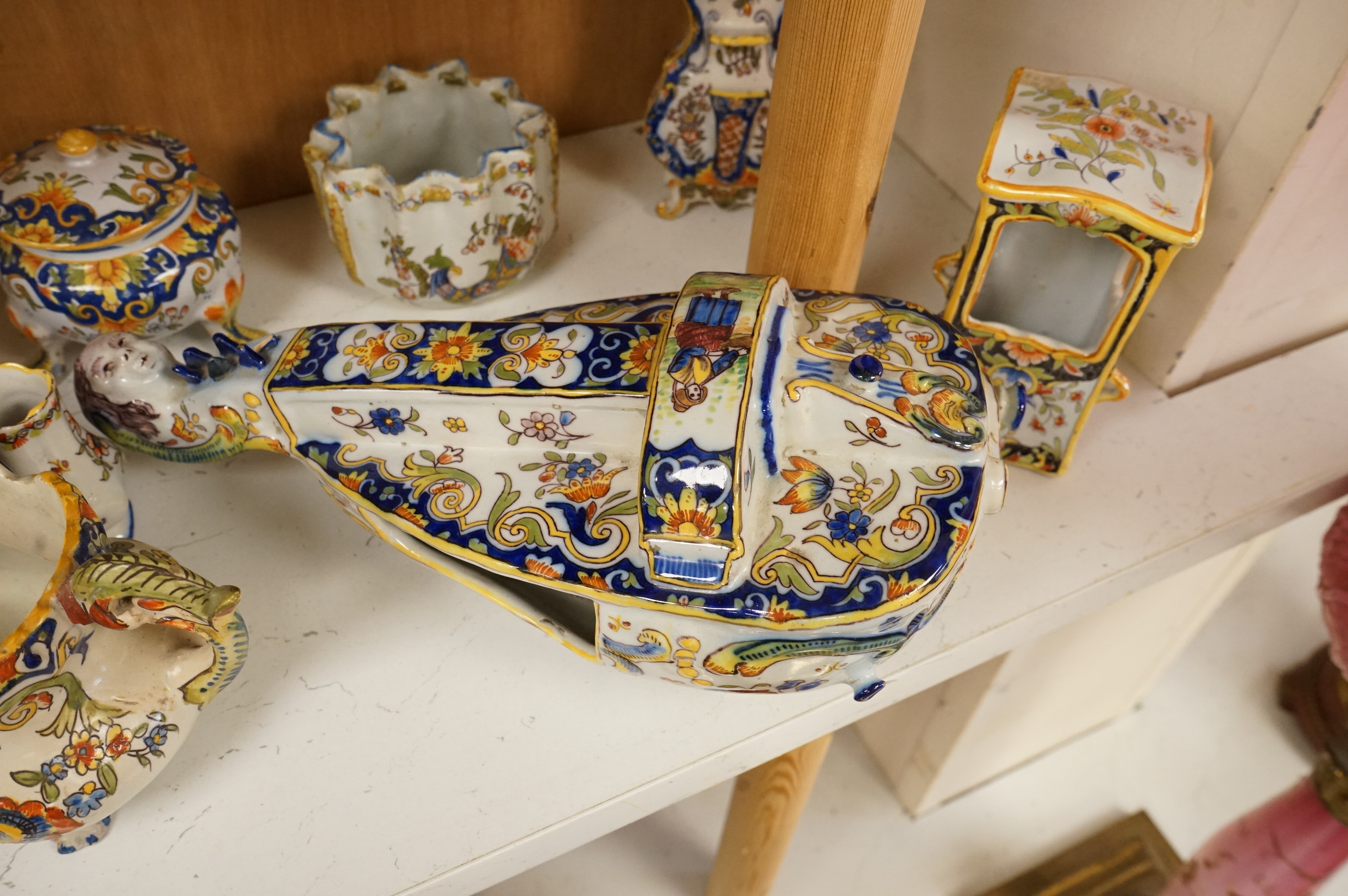 A group of French faience pottery to include trinket boxes, a teapot and vases, largest 32cm in length